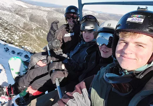 On a ski lift during the Trinity College 2023 Ski Trip
