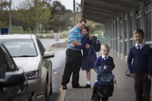 Parent dropping off child at Trinity