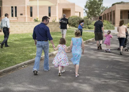 Young family walking towards St Francis Cathedral