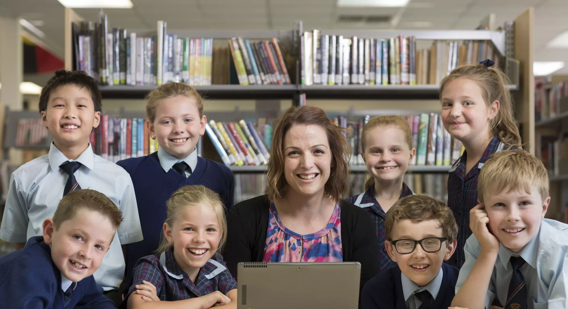 Junior school students with Trinity College teacher