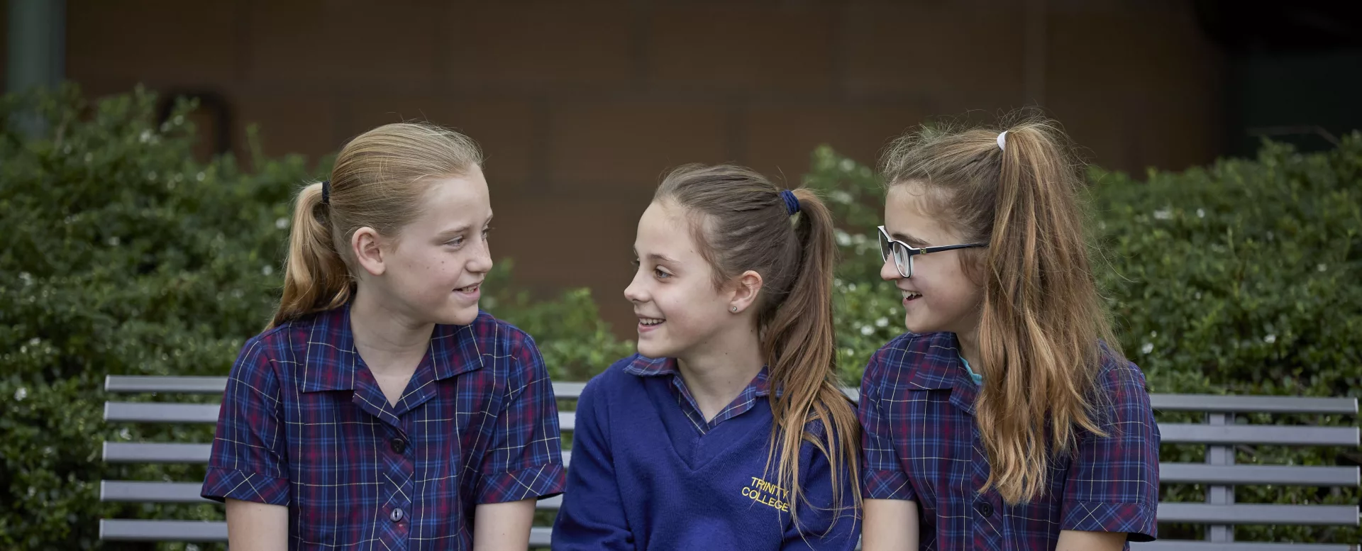 Junior school students on a bench