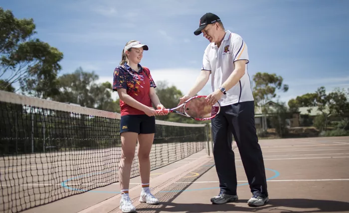 Trinity College student in the tennis program