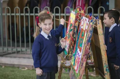 Junior Trinity College students painting