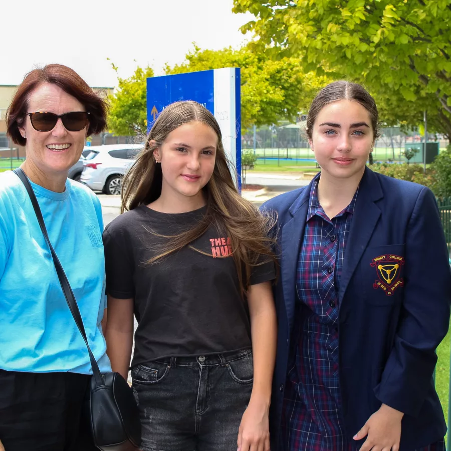 Mother & two daughters at 2023 Welcome to New Trinity College event