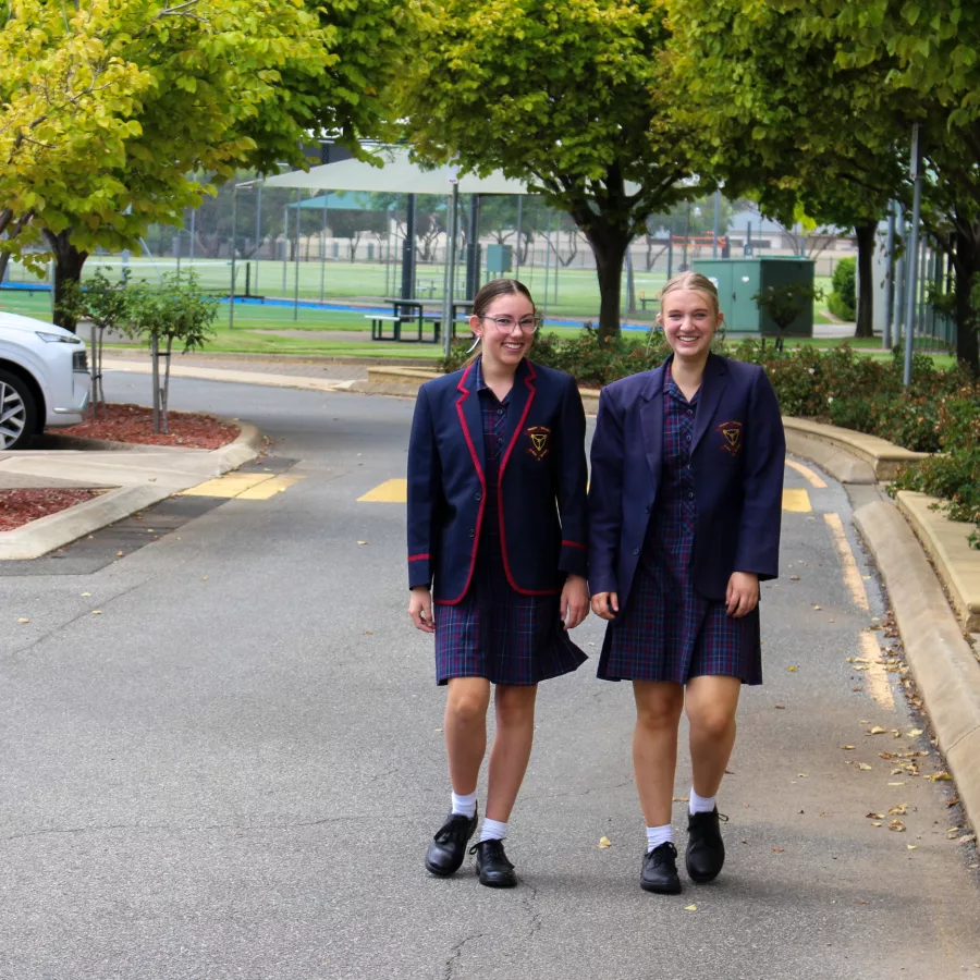 Two students walking at Trinity College Welcome Event 2023.