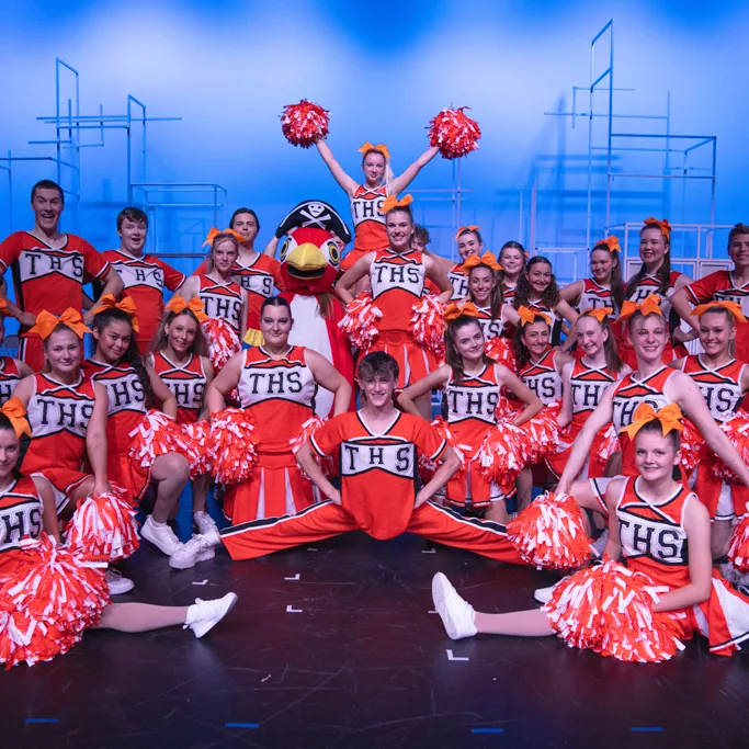 Trinity College 2023 musical "Bring It On" performers presenting on stage.