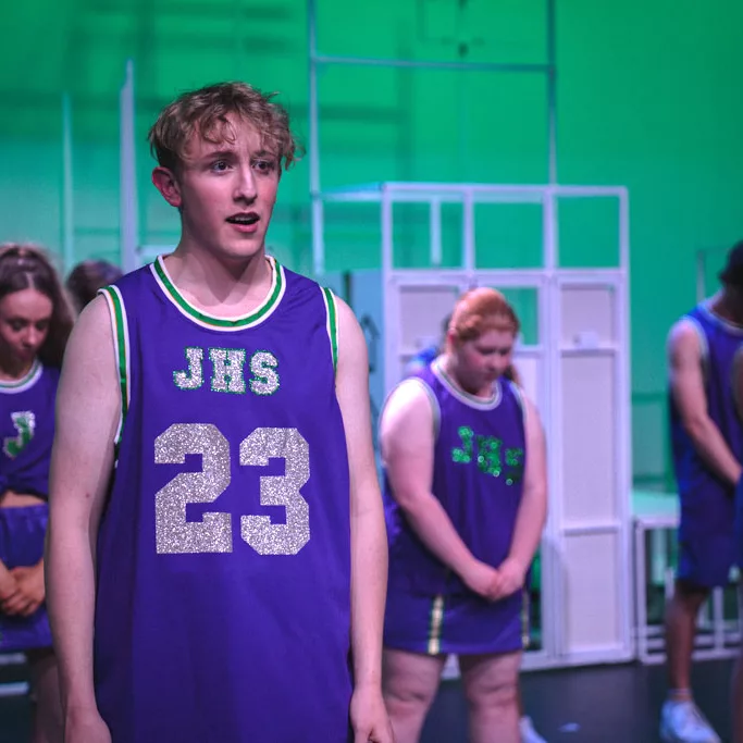 Students in blue performing in the 2023 College Musical “Bring it On”.