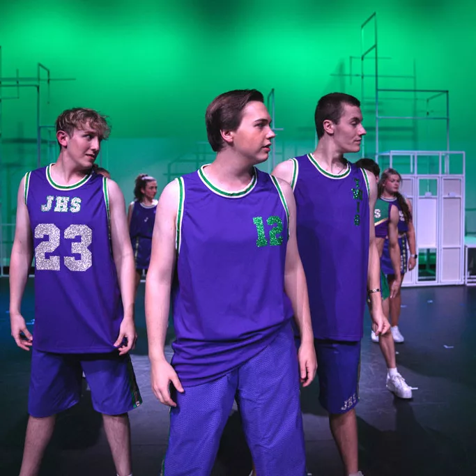 Three male performers during the Trinity College  Musical “Bring it On”.