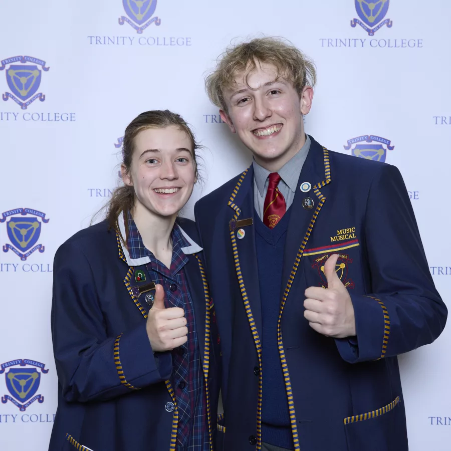 Two students give thumbs up at the official opening of the new Marnkutyi Parirna (Three Rivers) Theatre.